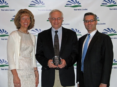 Chrissi Harding and Art Blank accept the Top 20 Critical Access Hospital Award for patient satisfaction on behalf of MDI Hospital from the National Rural Health Association president/ CEO, Alan Morgan, in Austin, Texas in early October.